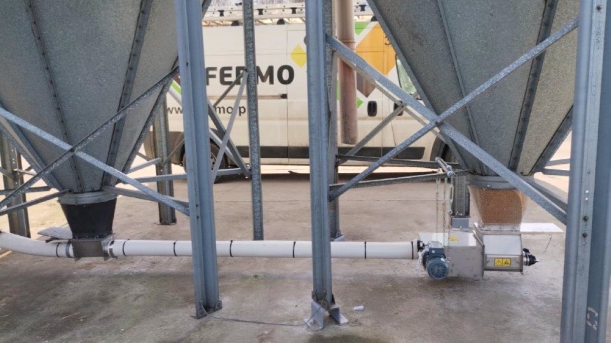 grain doser installed under a feed silo