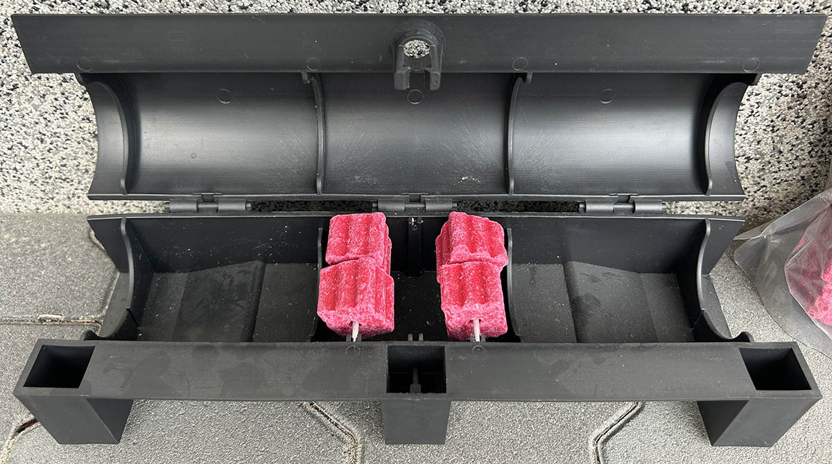 Rodent bait secured inside a tamper-resistant bait station