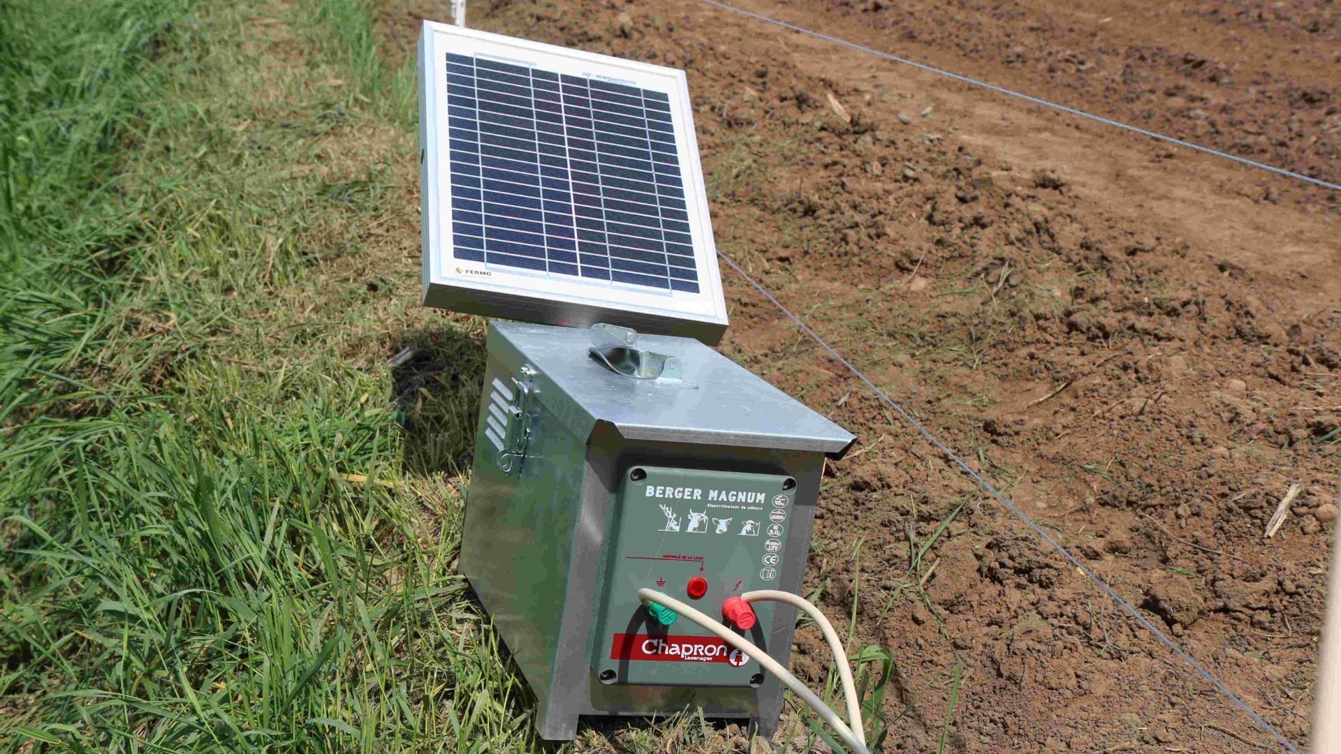 solar-powered electric fence in a field