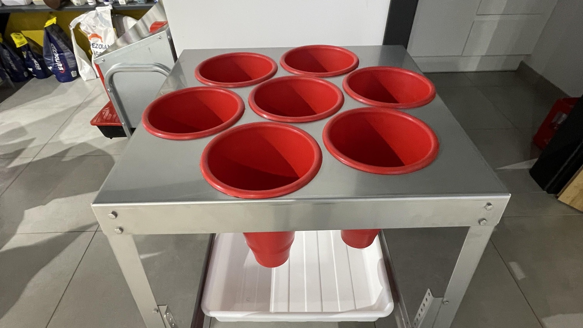 Poultry processing table with killing cones